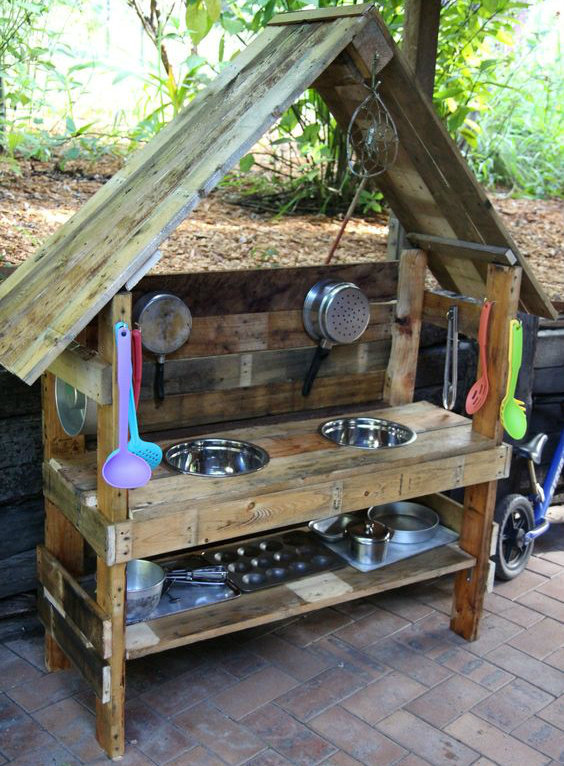 Mud Kitchen made from wood with a roof